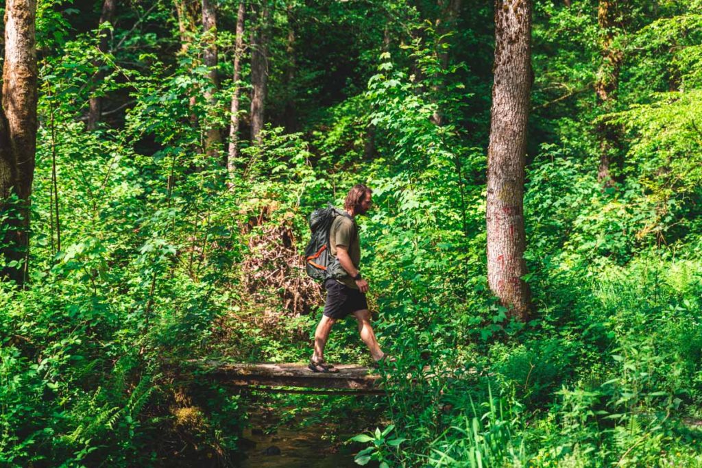 Crossing a small bridge during the hike in Botassart