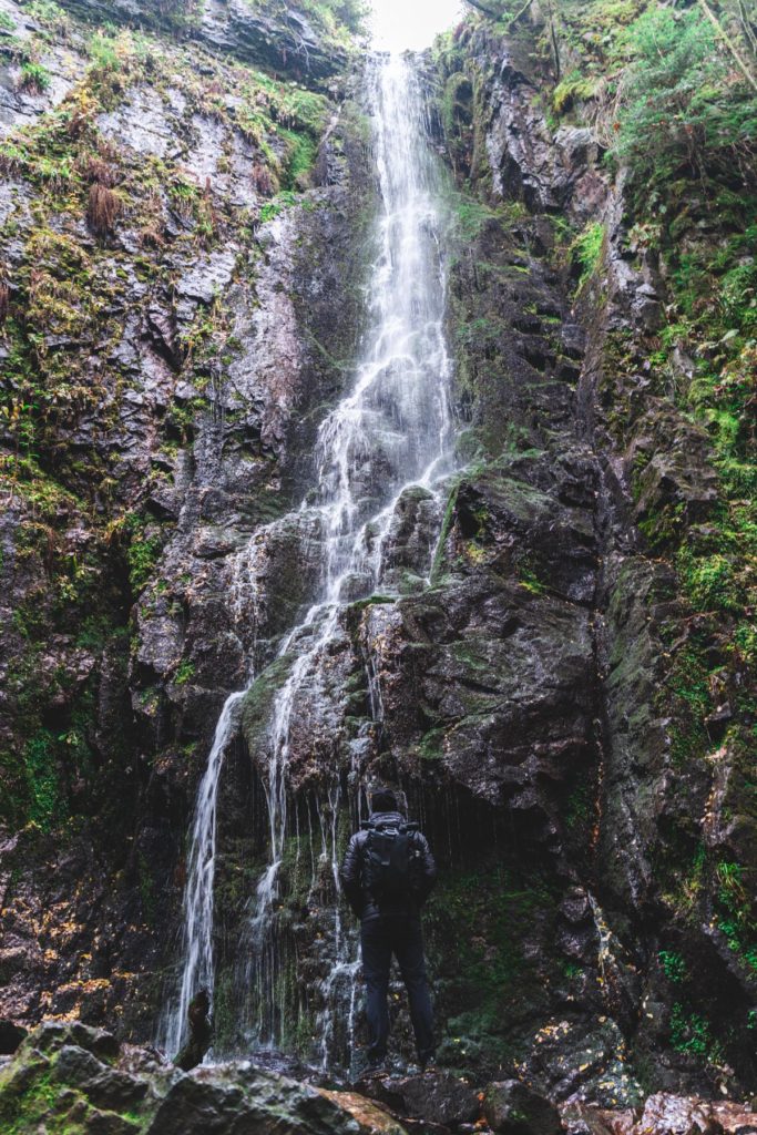 Me, posing in front of the majestic Burgbach waterfall in Germany